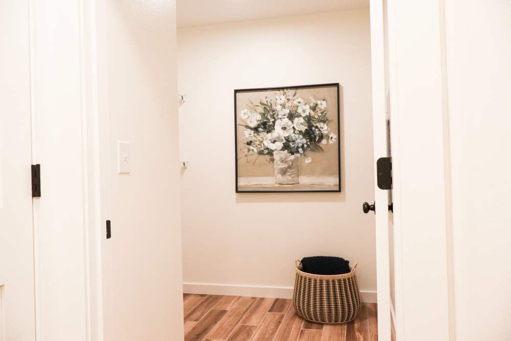 Bright entryway with wood-style flooring at Copper Trail Townhomes in Owasso, Oklahoma