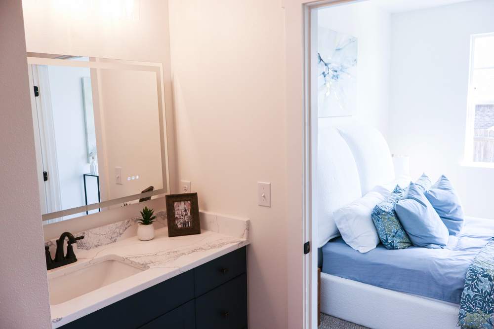 Modern bathroom and cozy bedroom retreat at Copper Trail Townhomes in Owasso, Oklahoma