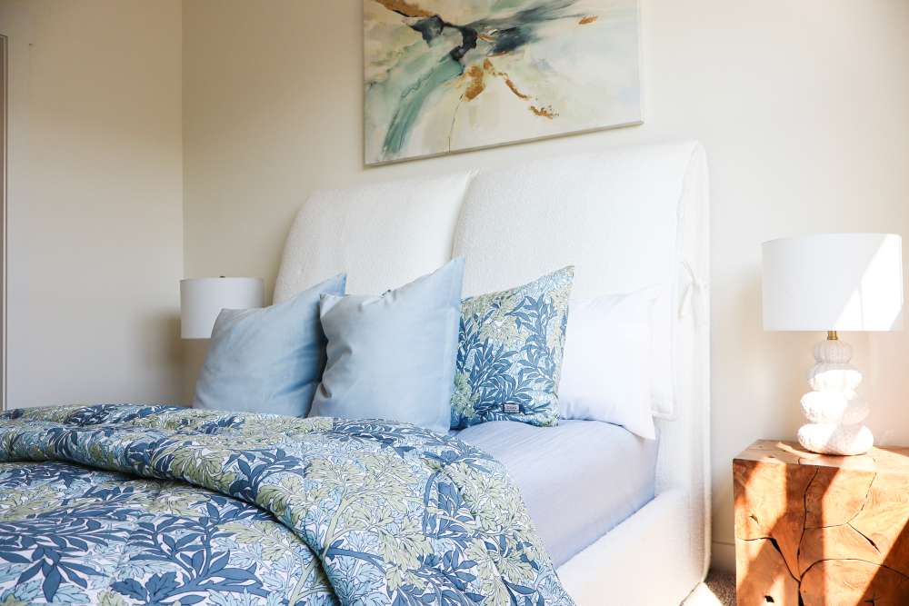 Cozy bedroom with stylish decor and soft lighting at Copper Trail Townhomes in Owasso, Oklahoma