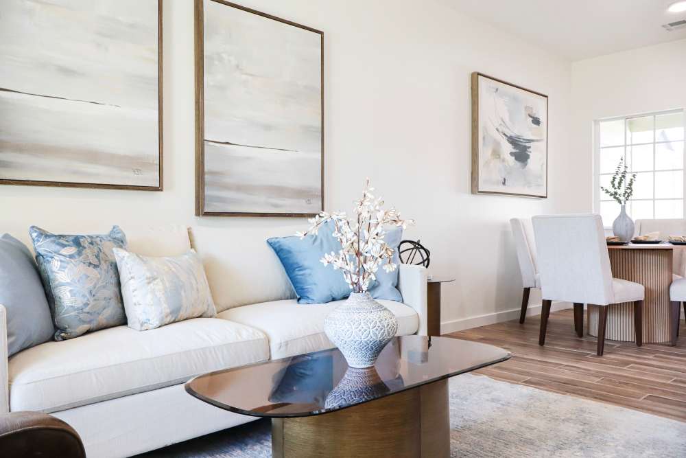 Bright living area with modern decor and dining space at Copper Trail Townhomes in Owasso, Oklahoma