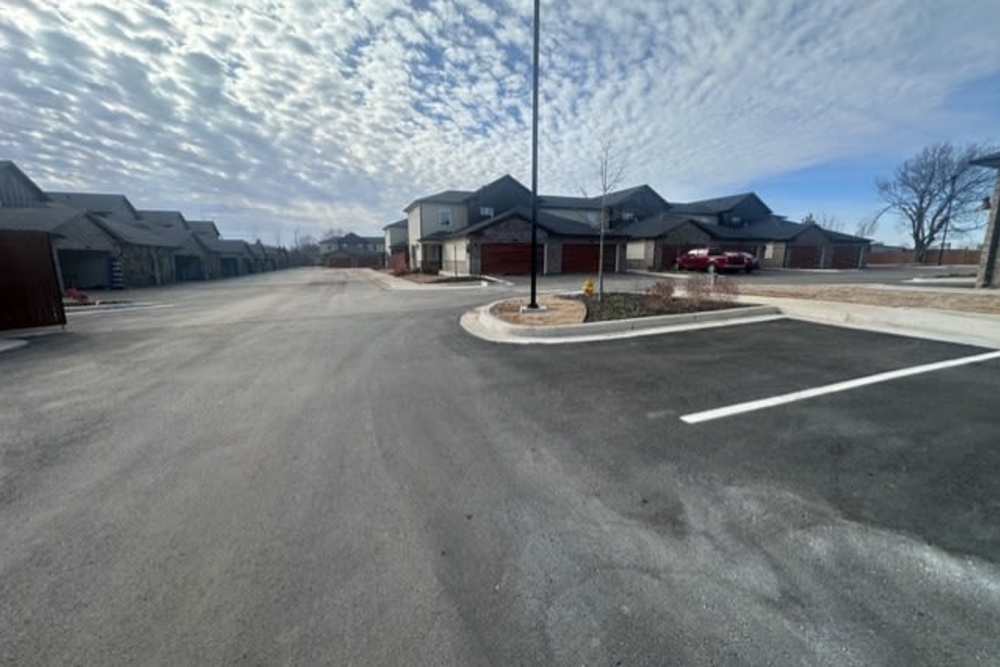 Gated community with ample parking spaces at Copper Trail Townhomes in Owasso, Oklahoma