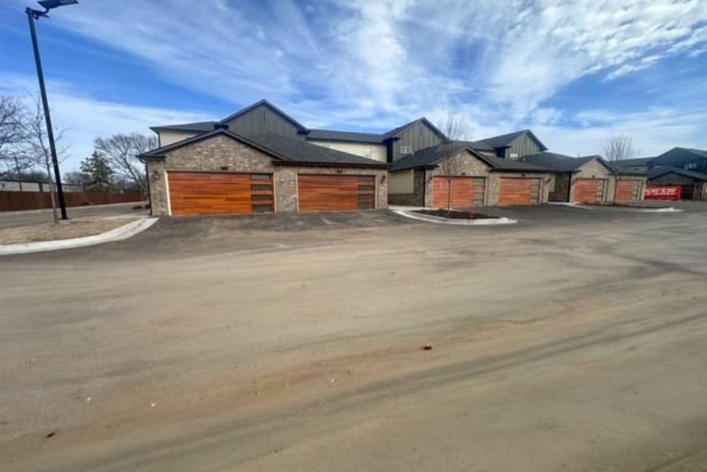 Gated community with modern garages at Copper Trail Townhomes in Owasso, Oklahoma