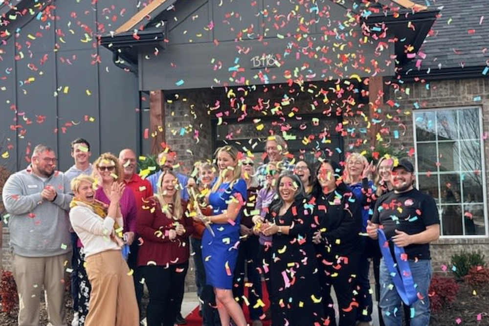 Celebration with confetti and happy residents at Copper Trail Townhomes in Owasso, Oklahoma