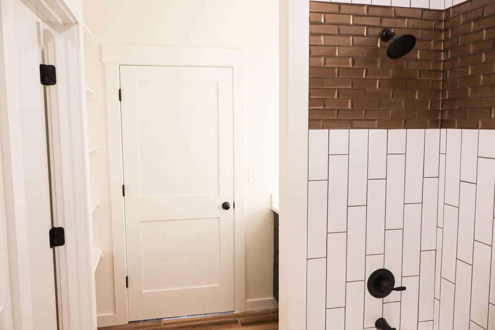 Modern bathroom with stylish shower design at Copper Trail Townhomes in Owasso, Oklahoma