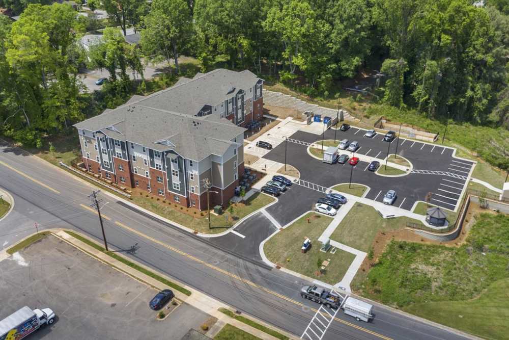 Apartment building with parking lot at Bluebird Commons in Statesville, North Carolina