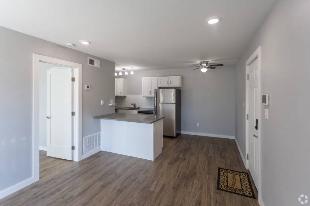 Open layout with wood-style flooring at Quail Ridge in Oklahoma City, Oklahoma