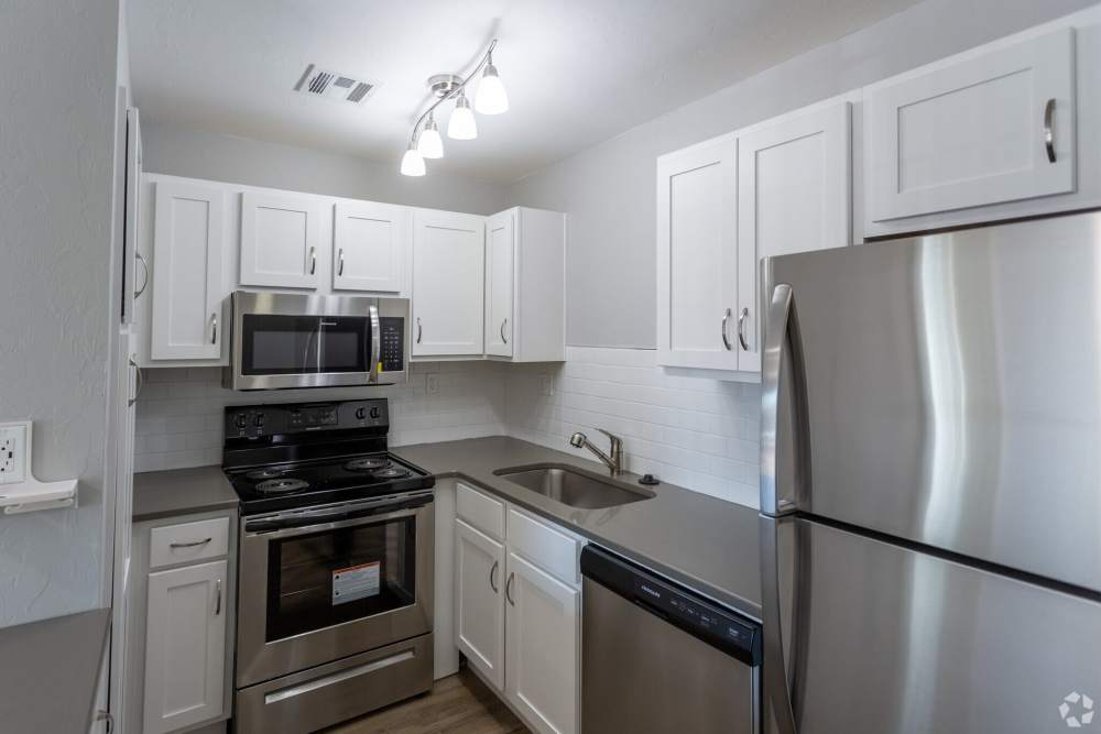 Modern kitchen with stainless steel appliances at Quail Ridge in Oklahoma City, Oklahoma