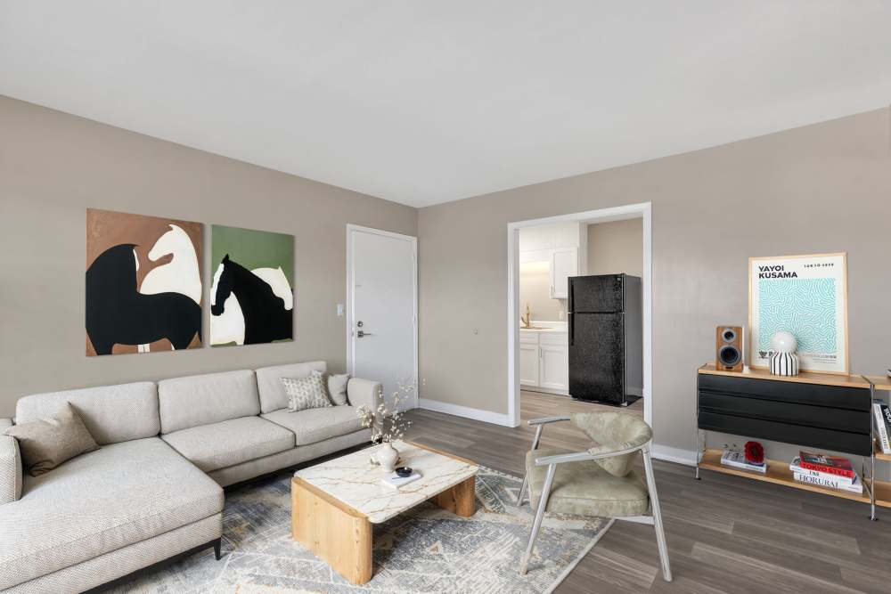 Living room with wood-style flooring at Bristol Square Apartments in Bristol, Tennessee 