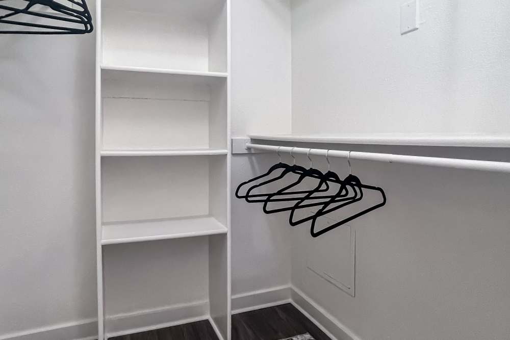 Closet with shelf at Savannah Square & Savannah Harbor in Norman, Oklahoma