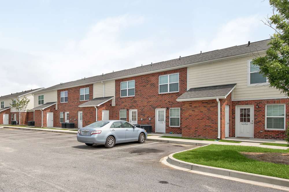 Brick apartment building with parking spaces at Butler Crossing I in Kingstree, South Carolina