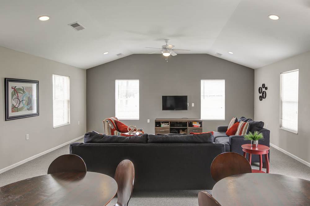Spacious living room with sectional sofa and TV at Butler Crossing I in Kingstree, South Carolina