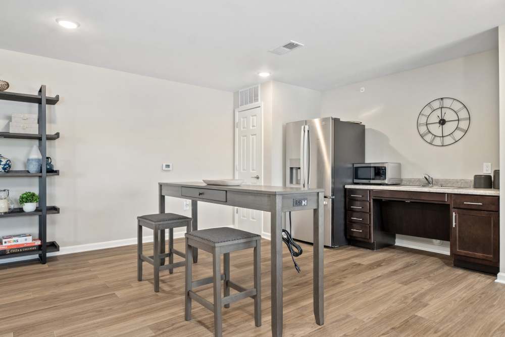 Clubhouse kitchen with island and stainless steel appliances at Five Points Crossing in Rocky Mount, North Carolina