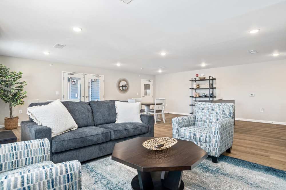 Clubhouse seating area with modern furnishings at Five Points Crossing in Rocky Mount, North Carolina