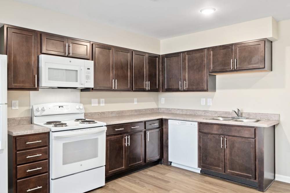 Modern kitchen with granite countertops at Five Points Crossing in Rocky Mount, North Carolina