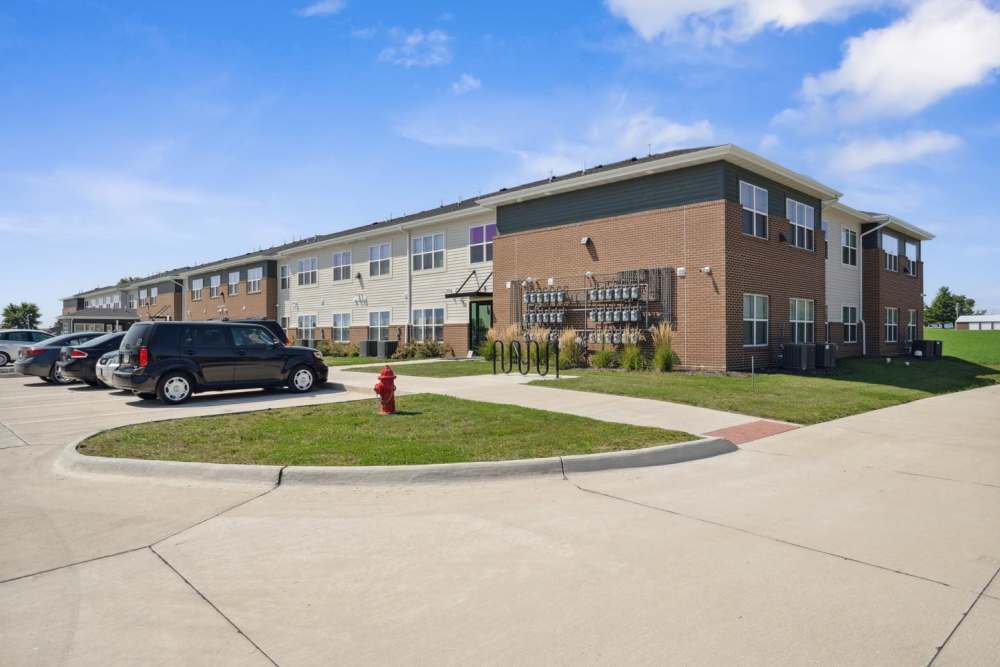 Modern apartment community with ample parking spaces at Chandler Pointe in Wilton, Iowa