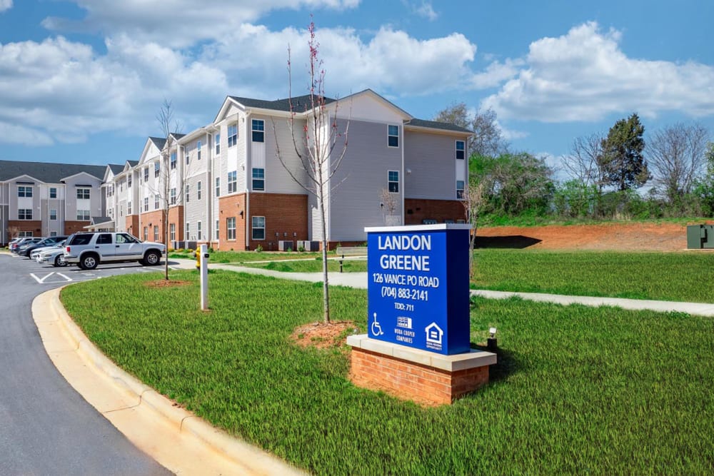 Bright exterior with landscaped lawn at Landon Greene in Statesville, North Carolina