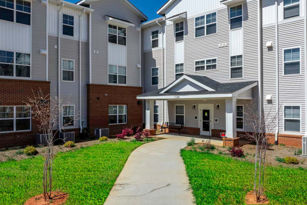 Welcoming entrance with landscaped pathway at Landon Greene in Statesville, North Carolina