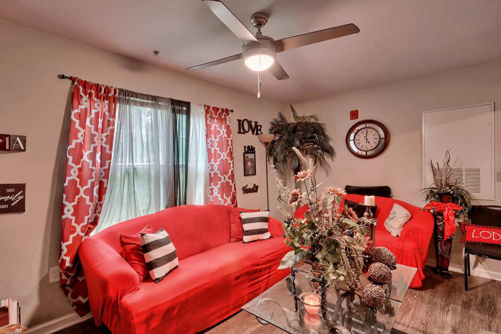 Living room with red sofa at Lowcountry Crossing in Denmark,South Carolina