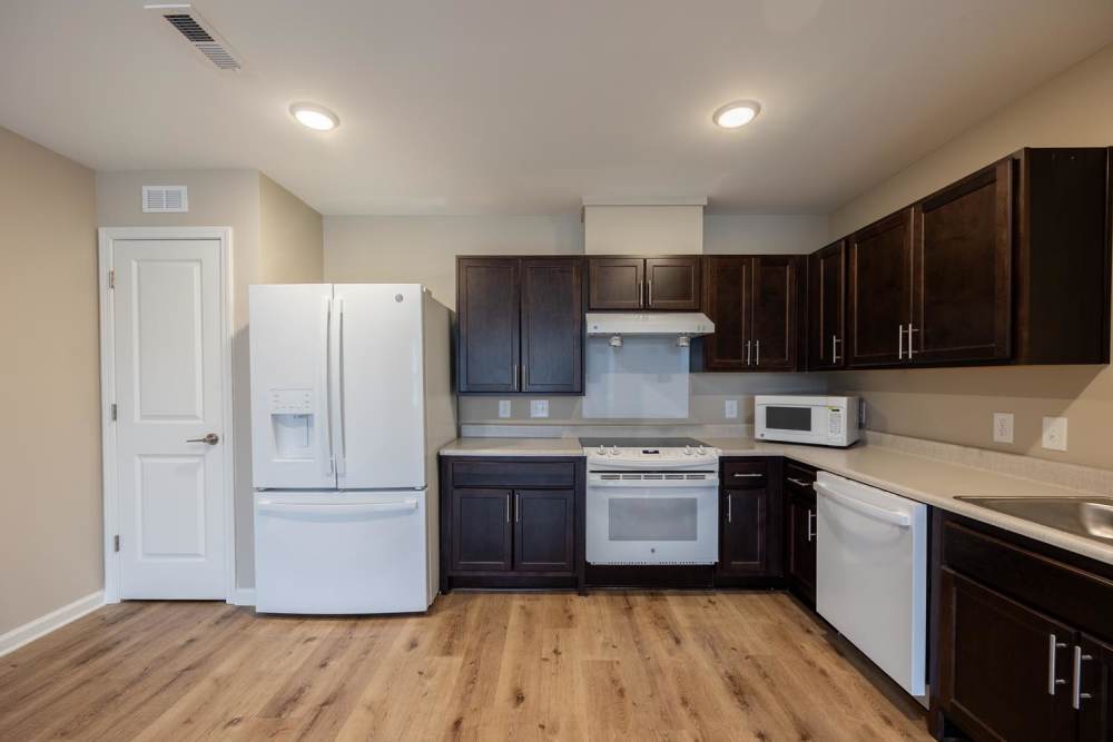 Modern kitchen with stainless steel appliances at Pender Crossing in Wilson, North Carolina