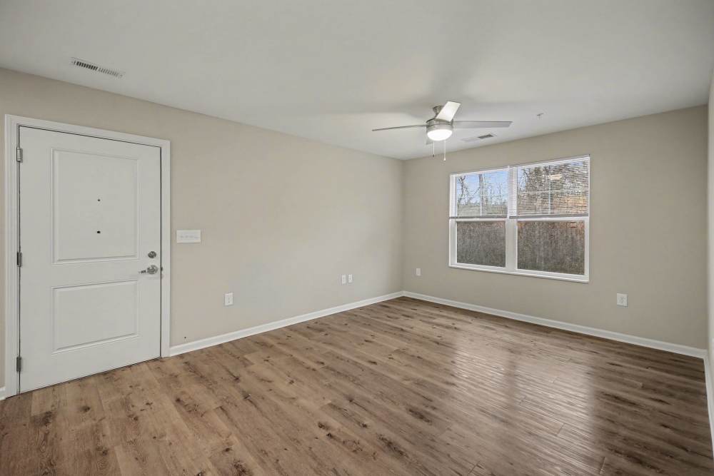 Living area with large windows for natural light at Rutherford Crossing in Cherryville, North Carolina
