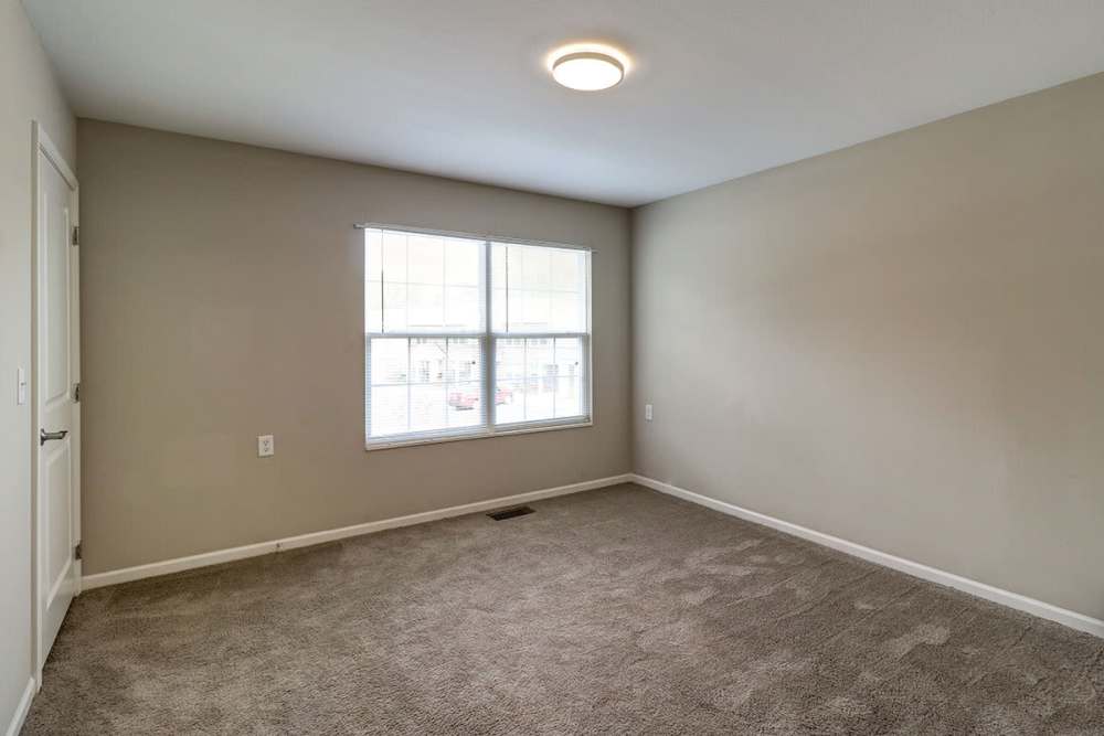 Spacious room with large window providing natural light at Parrish Greene in Estill, South Carolina