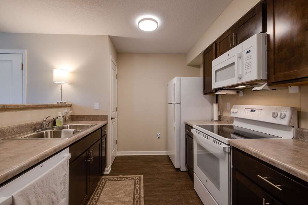 Modern kitchen with granite countertops at Williams Terrace in Indianola, Iowa