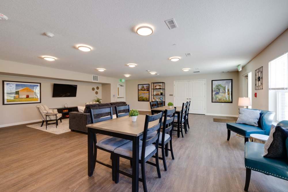 Community lounge with seating and dining area at Williams Terrace in Indianola, Iowa