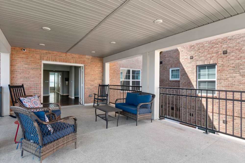 Spacious balcony with comfortable seating and a view of the community at Kirkman Terrace in Hopkinsville, Kentucky