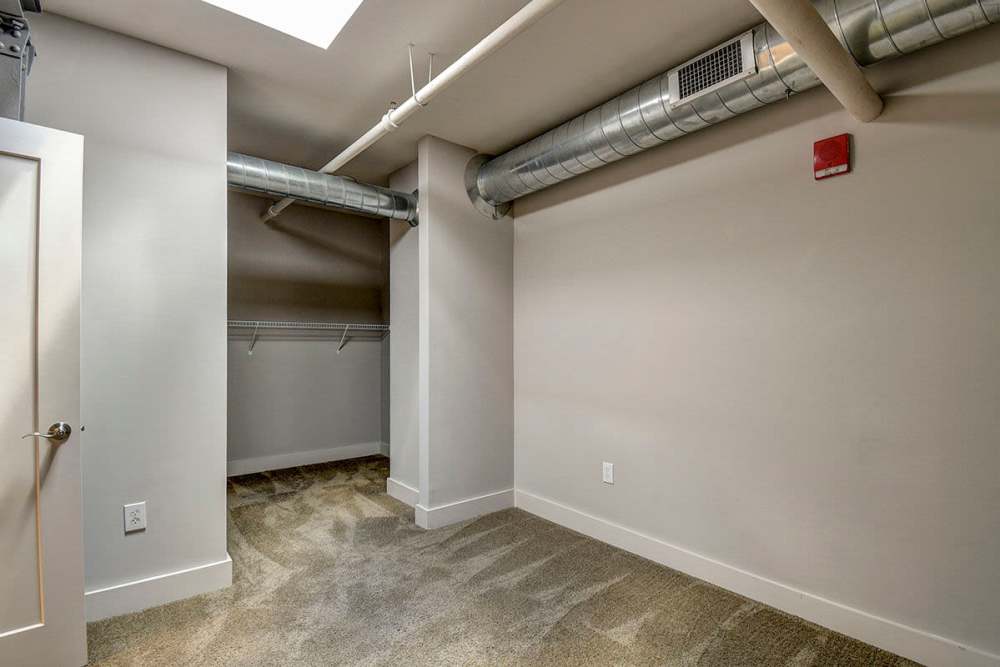 Apartment bedroom with closet space at Stone Center Lofts in Wheeling, West Virginia