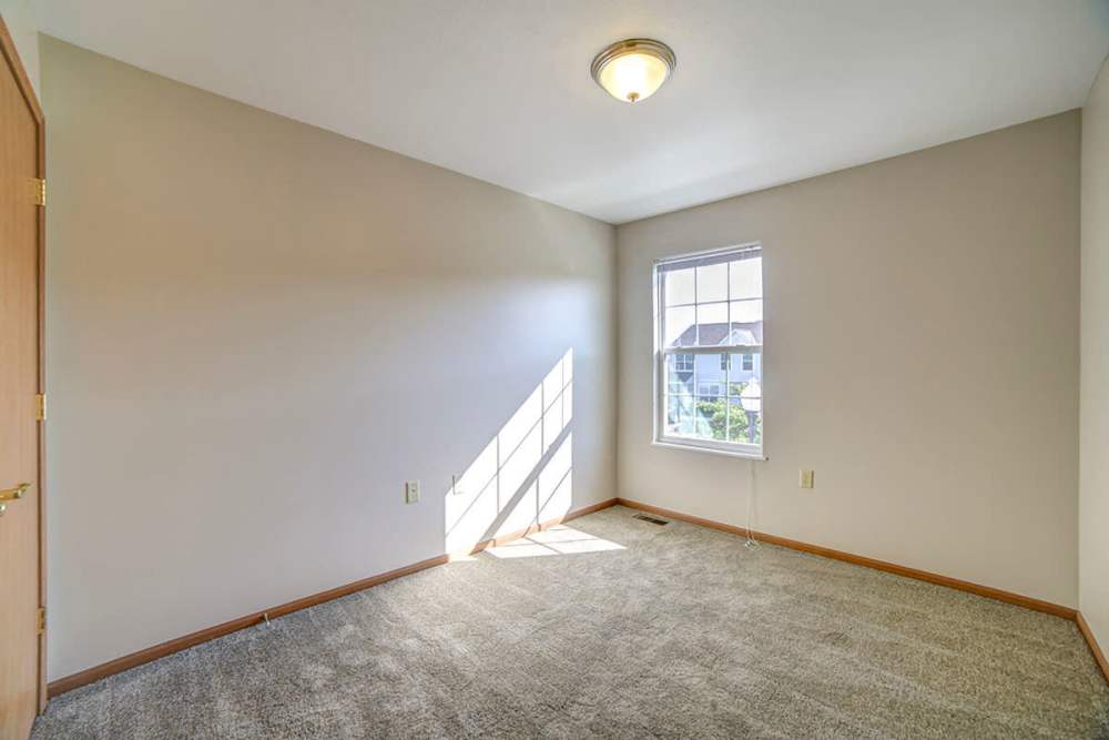 Unfurnished bedroom with carpet flooring and window at Raystown Crossing in Shippensburg, Pennsylvania