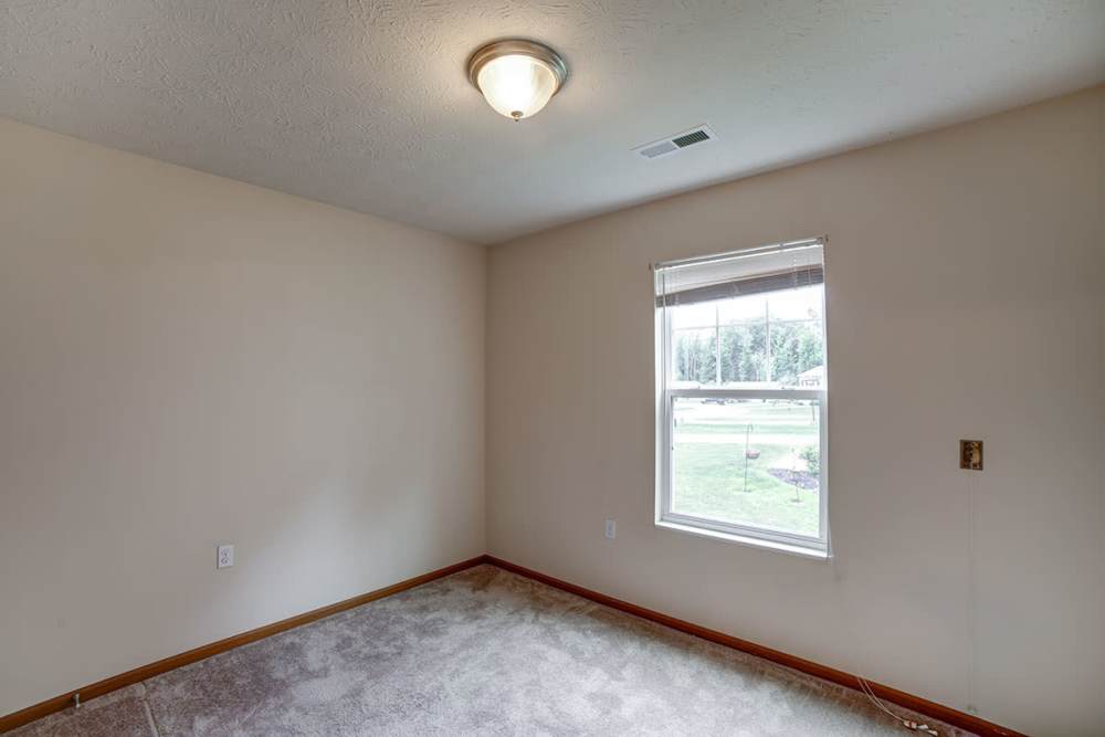 Bedroom with window at Quaker Meadows in Hermitage, Pennsylvania