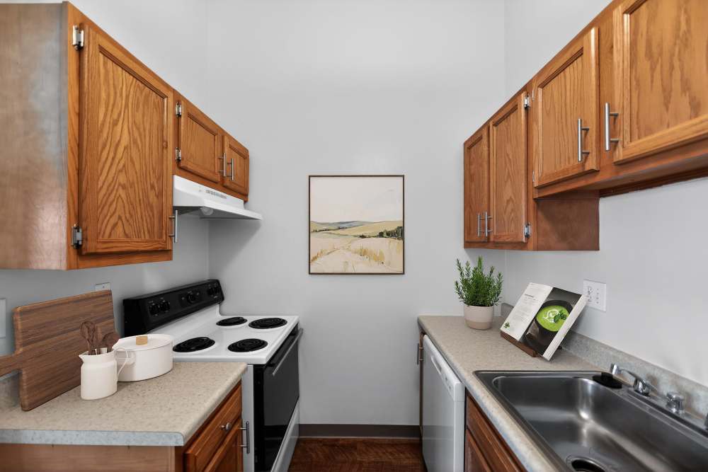 Kitchen with wooden flooring at Mansions at Delmar, an Eagle Rock Community in Delmar, New York