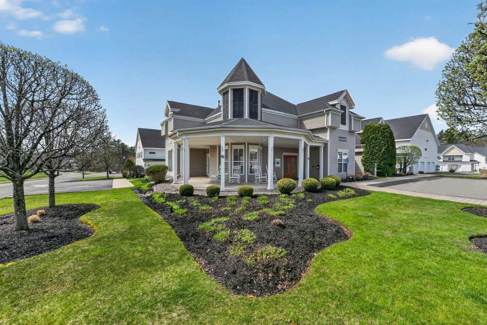 Community exterior view with lawn  at Mansions at Delmar, an Eagle Rock Community in Delmar, New York