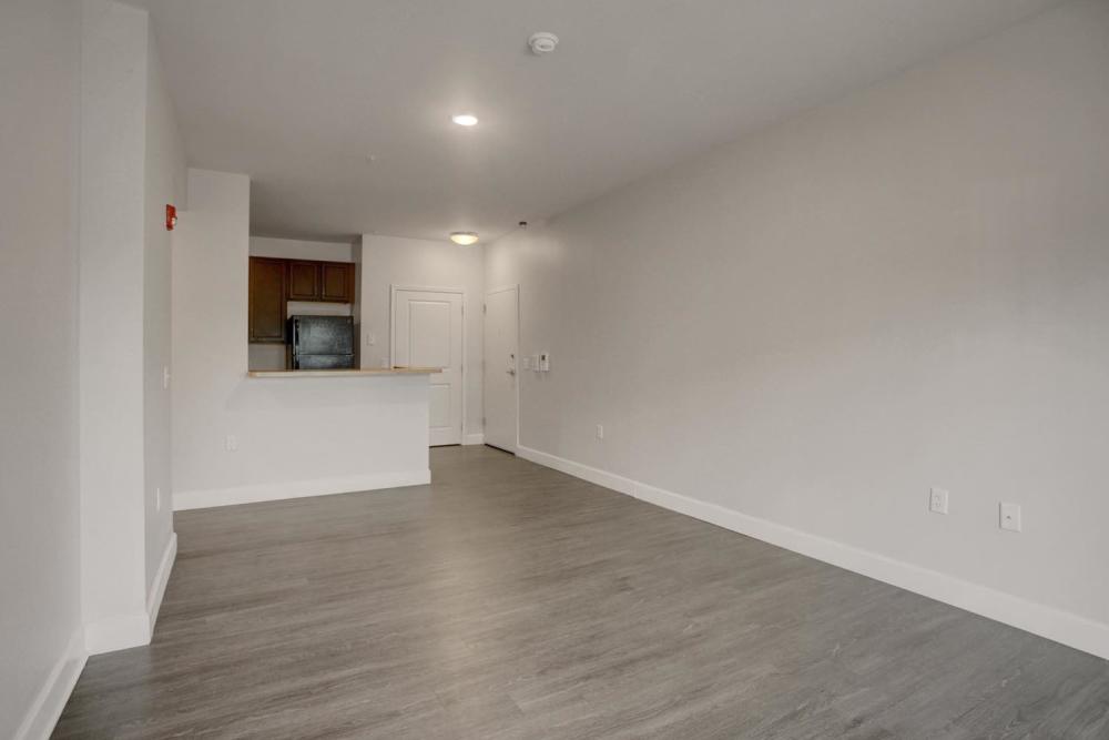 Living area with connecting kitchen at Flats at Factory Square in Carlisle, Pennsylvania