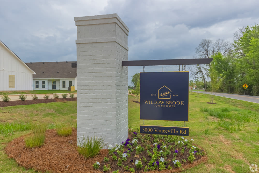 Entrance Sign with Blue Shingle and White Brick