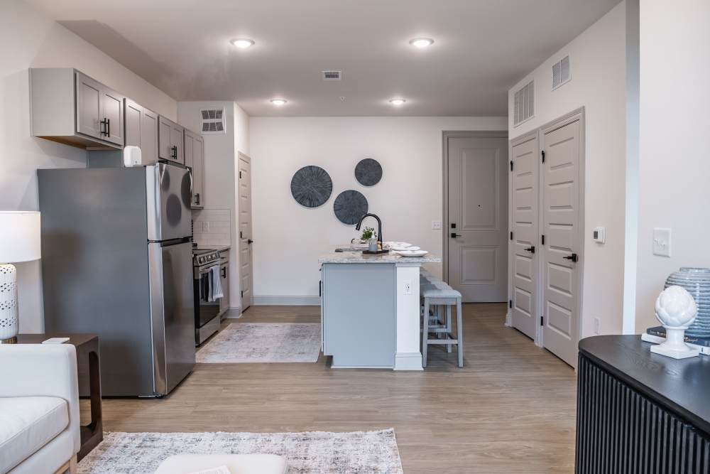 Apartment kitchen with island and seating at The Flats at Crosspointe in Columbia, South Carolina