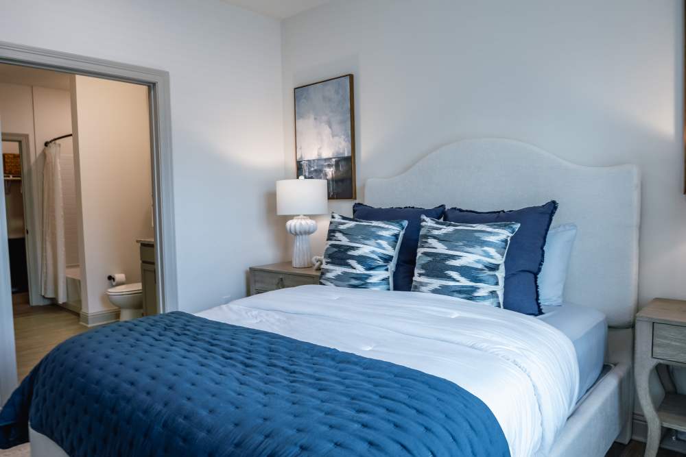 Bedroom angle showing window and bed at The Flats at Crosspointe in Columbia, South Carolina