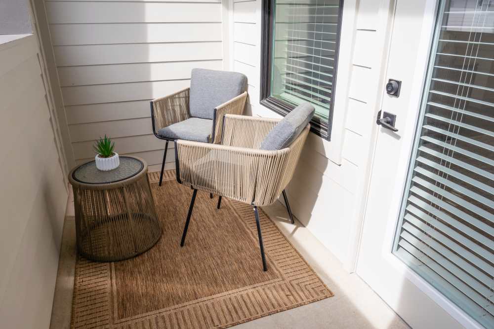 Sunlit seating area near window at The Flats at Crosspointe in Columbia, South Carolina