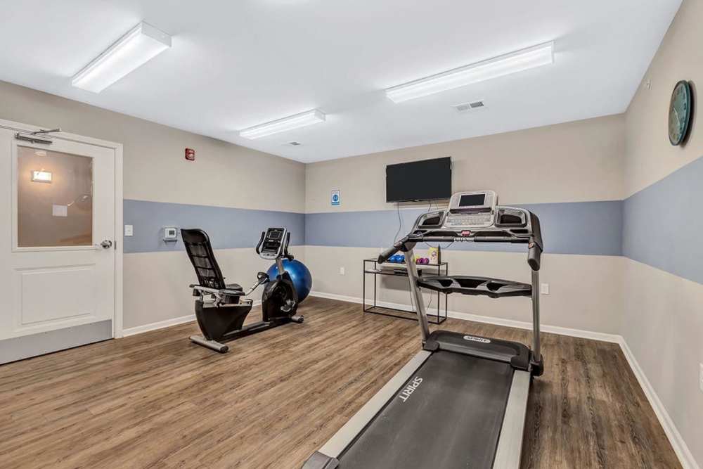 Fitness center with a treadmill at Audubon Crossing Senior Community in Dayton, Ohio 