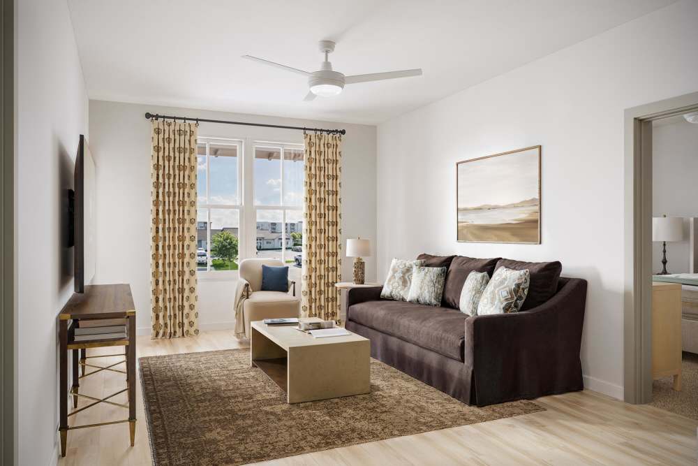 Cozy living room with natural light at Romero Apartments in Pensacola, Florida