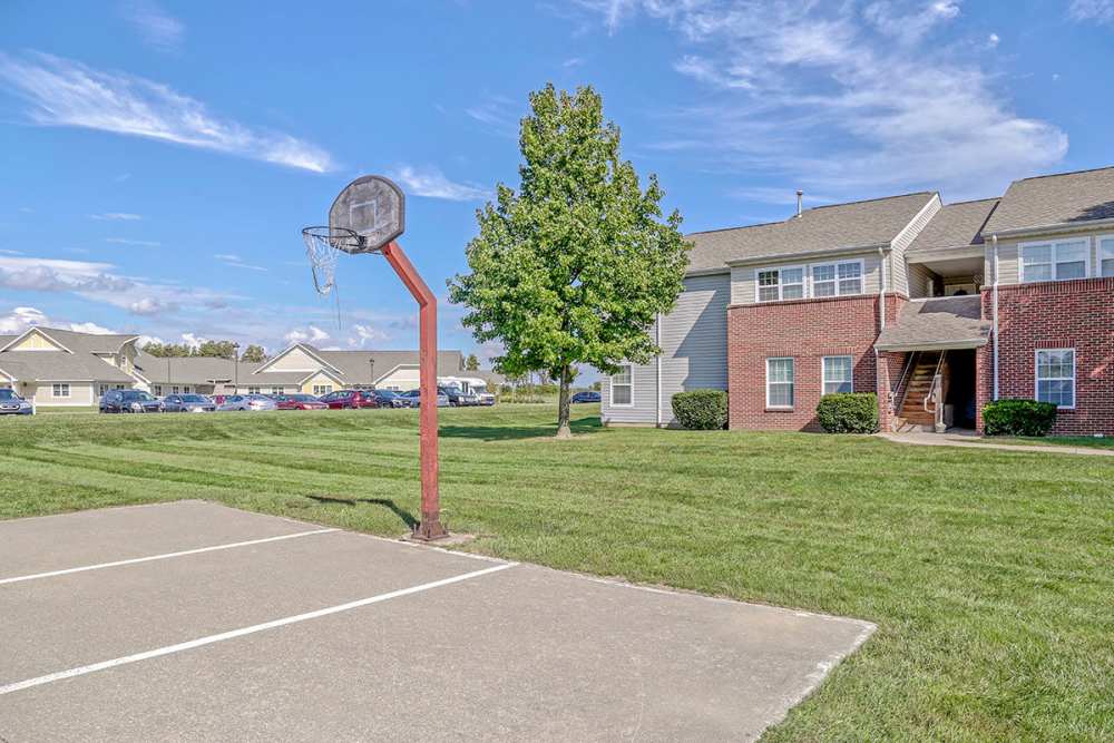 Basketball hoop with grassy area at apartments at Glennview Apartments in Washington Court House, Ohio