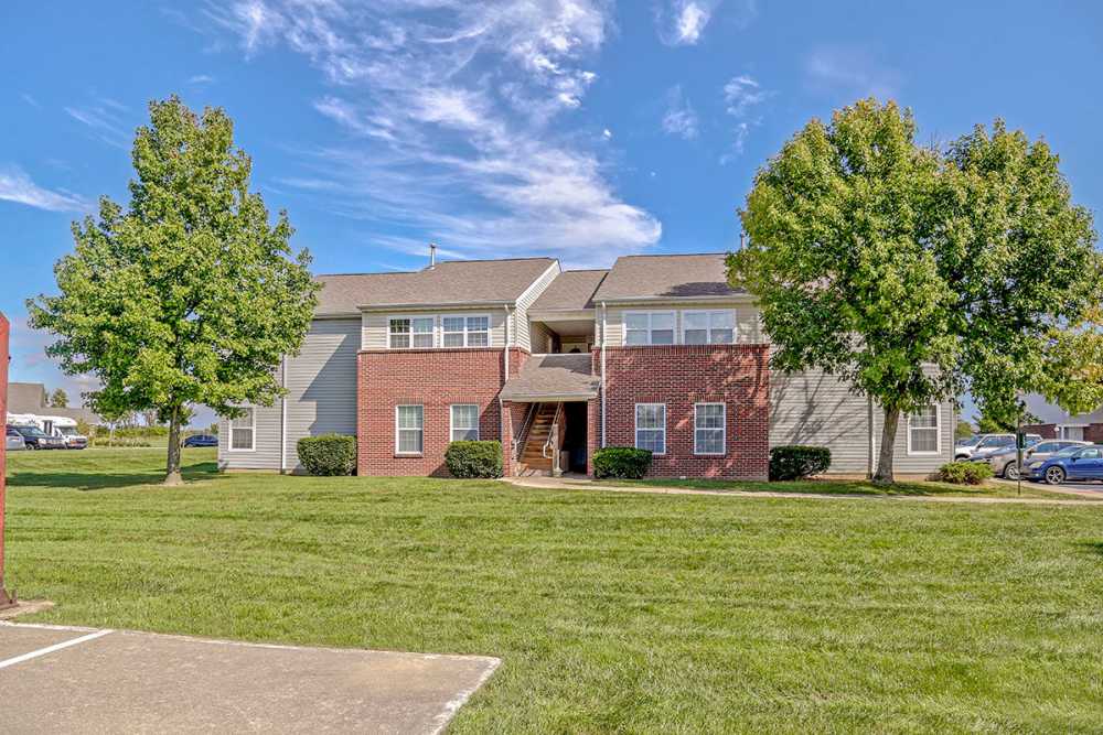 Building exterior with landscaped lawn at Glennview Apartments in Washington Court House, Ohio