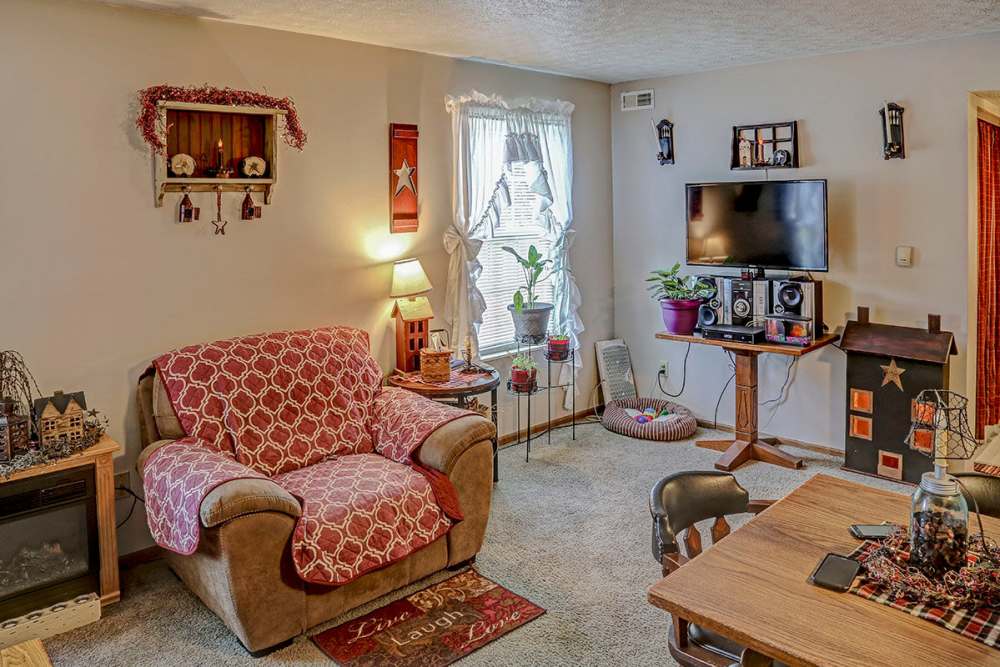 Cozy living room with decorative accents at Glennview Apartments in Washington Court House, Ohio