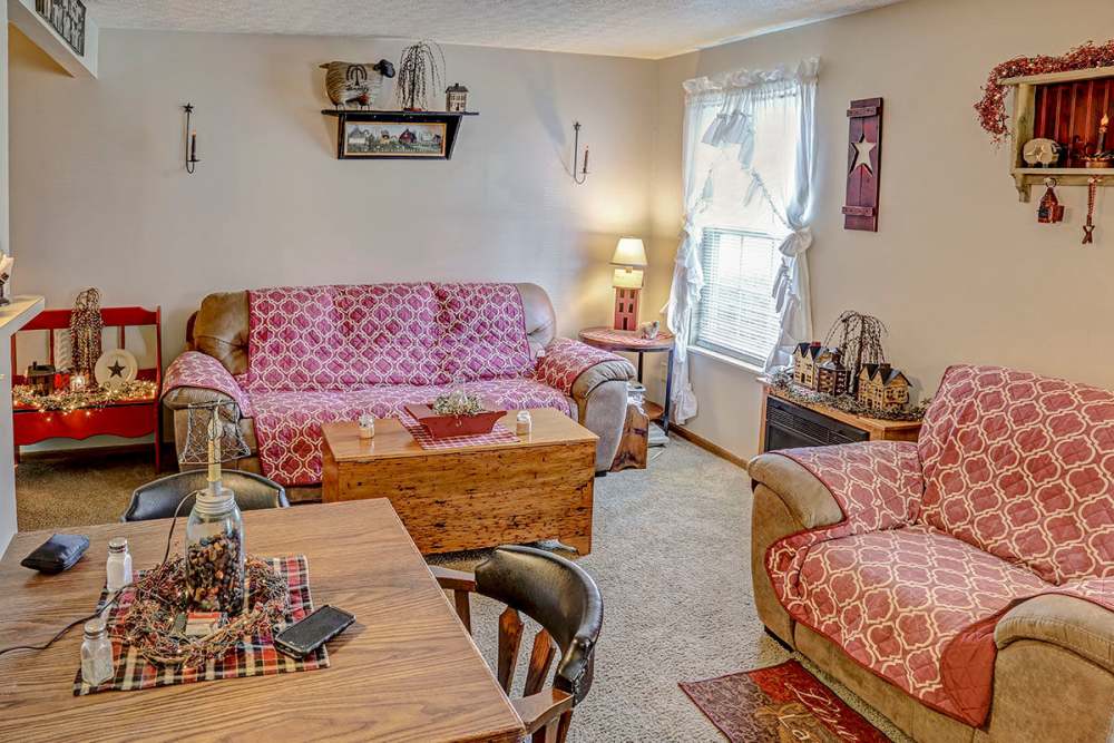 Cozy living room with comfortable seating at Glennview Apartments in Washington Court House, Ohio