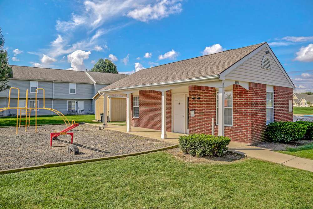 Playground area with seating at community entrance Glennview Apartments in Washington Court House, Ohio