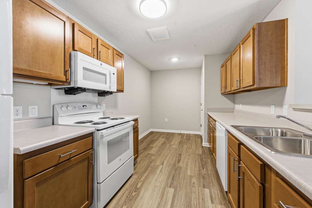 Modern kitchen with granite countertops at Granville Woods Lofts in Columbus, Ohio