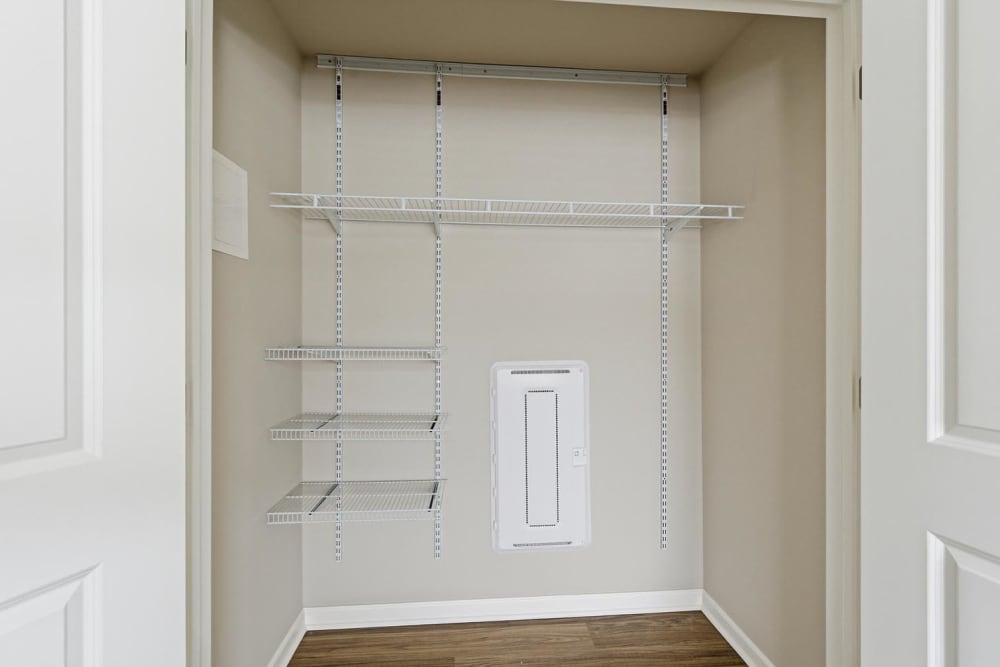 Spacious closet with wire shelving and wood-style flooring at Granville Woods Lofts in Columbus, Ohio