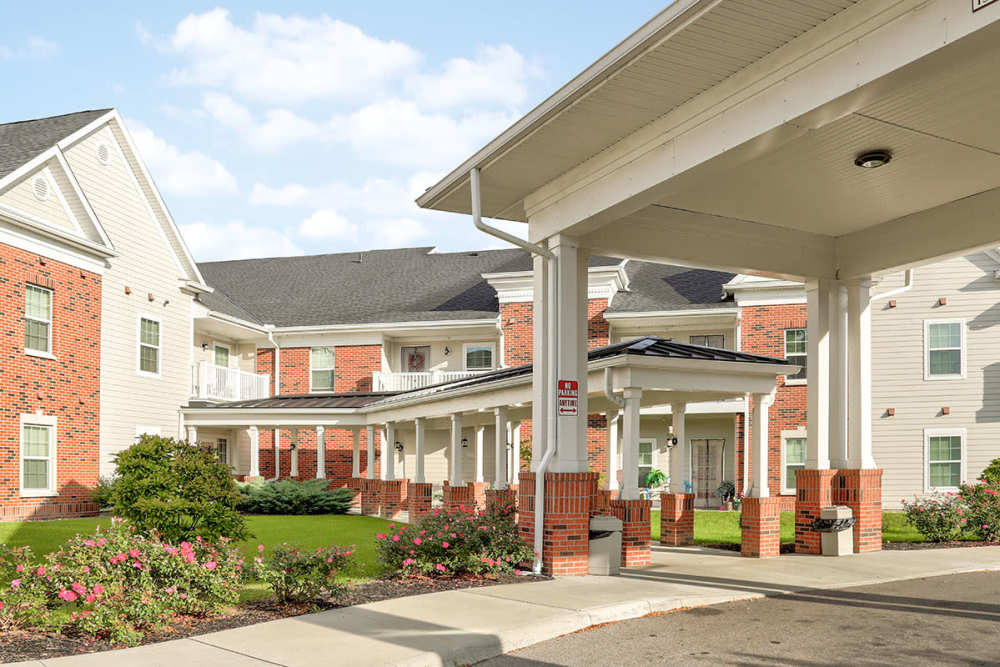 Gated entrance with landscaped gardens and brick accents at Hayden House in Springfield, Ohio