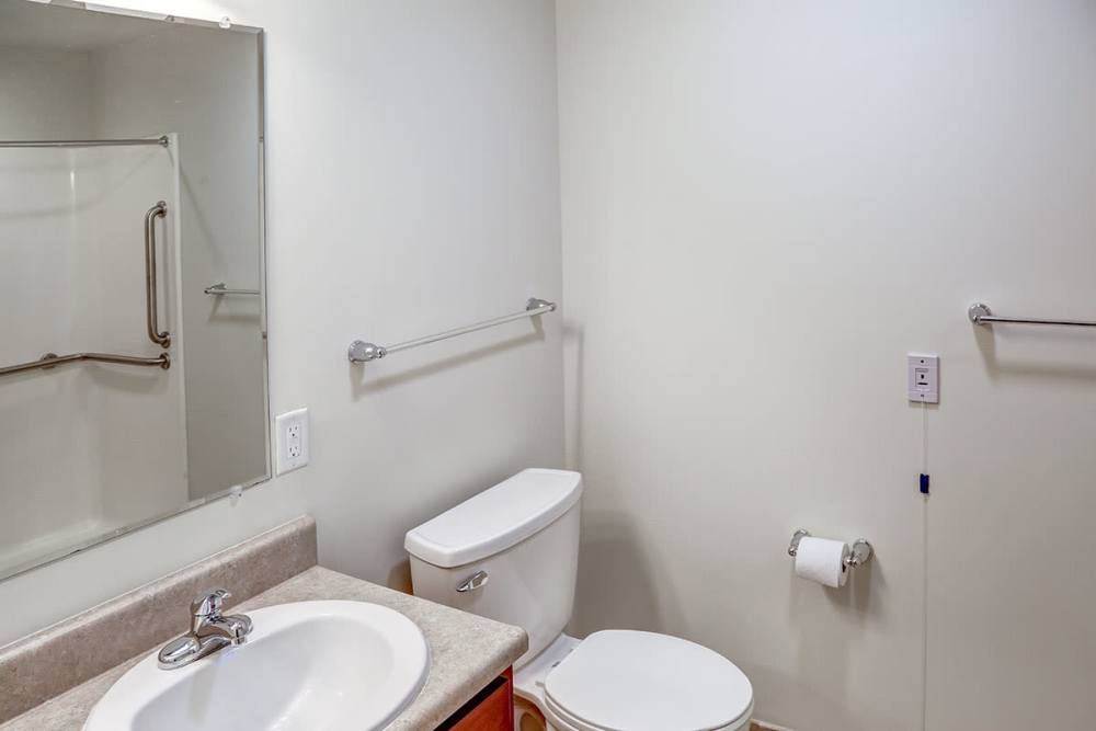 Bright bathroom with a large mirror at Hayden House in Springfield, Ohio