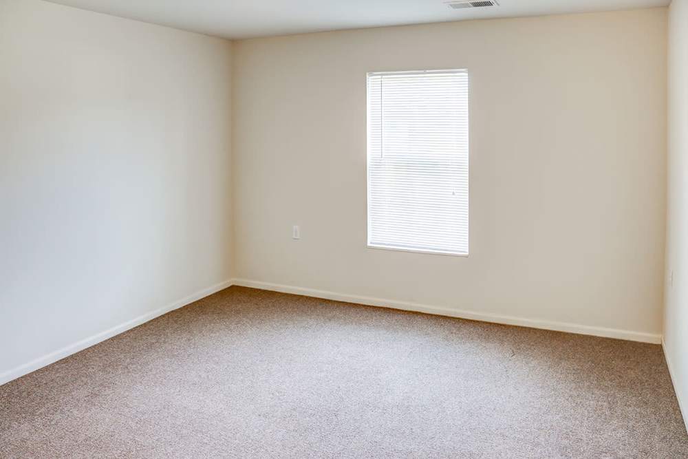 Empty room with beige carpet at Hayden House in Springfield, Ohio